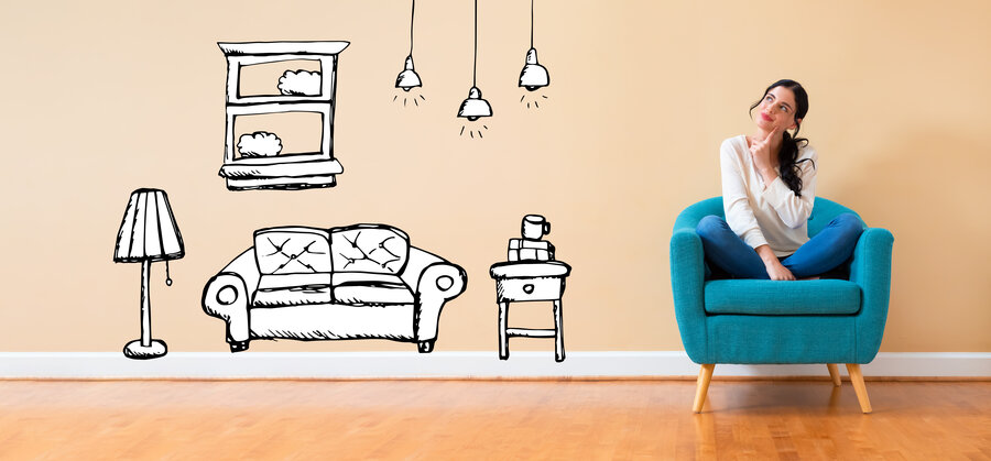 New apartment dream with woman in a thoughtful pose in a chair